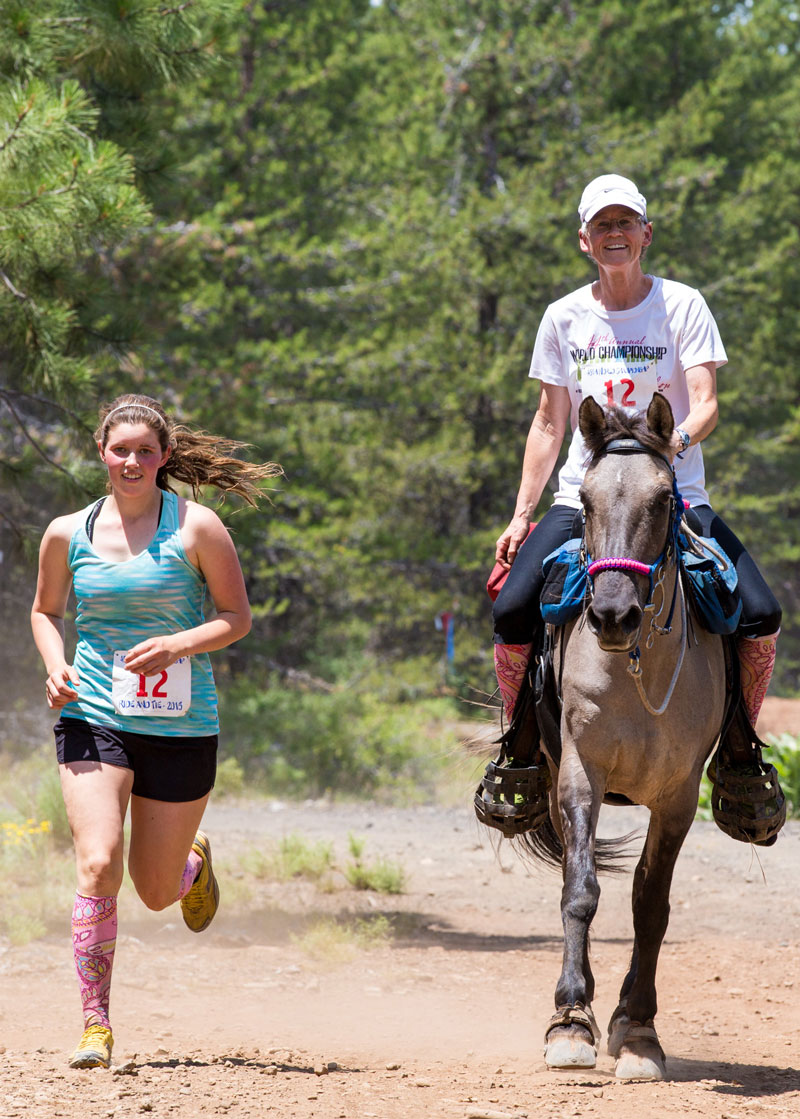 Image of a rider and runner.